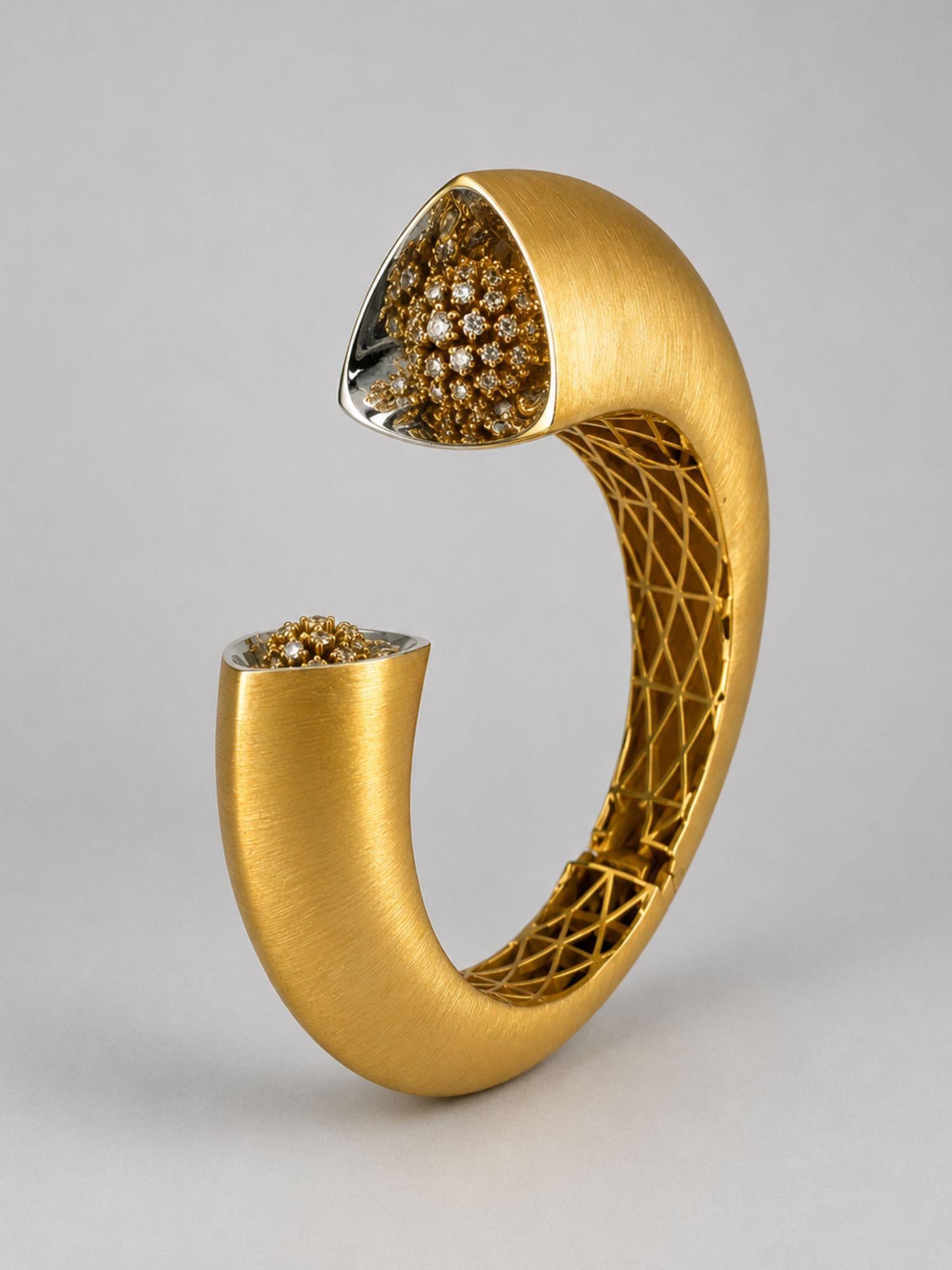 Close angled shot of Irodori gold cuff showing handcrafted lattice interior and CZ flower motif tip detail.