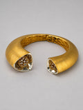 Irodori Double Motif Cuff in 24k gold with CZ-set triangular tip on open recycled silver cuff, three-quarter angle.