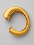 Top-down view of Irodori Double Motif Cuff in brushed 24k gold showing open cuff form and inner lattice.