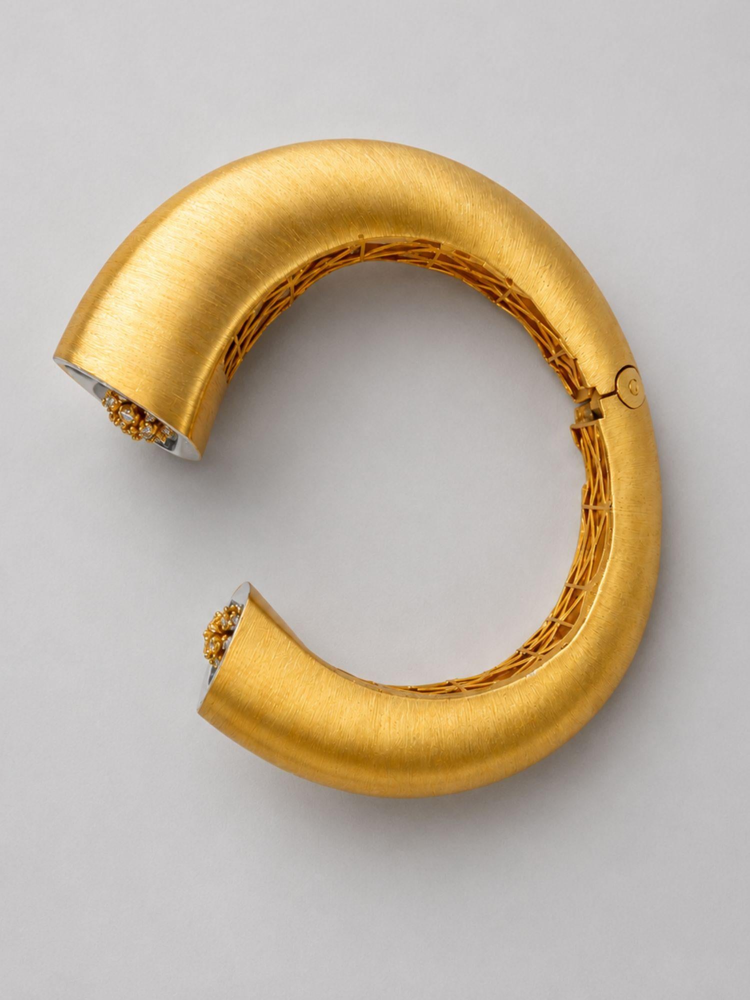 Top-down view of Irodori Double Motif Cuff in brushed 24k gold showing open cuff form and inner lattice.