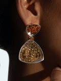 Irodori large drop statement earring with amber zircon and silver triangle worn in profile on model.
