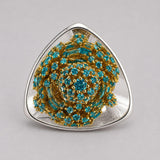 Close view of MHARI Irodori Large statement earring in 925 silver with turquoise stone setting