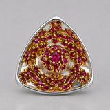 Close detail of MHARI Irodori Medium statement earring with pink and gold zircon setting on 925 silver