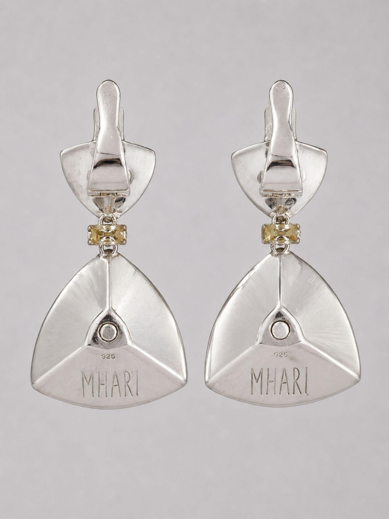 Back view of MHARI Irodori Mix earrings showing MHARI brand stamp on mirror-polished 925 silver