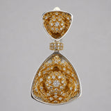 Close detail of MHARI Irodori Mix statement earring, gold zircon kaleidoscope motif on 925 silver