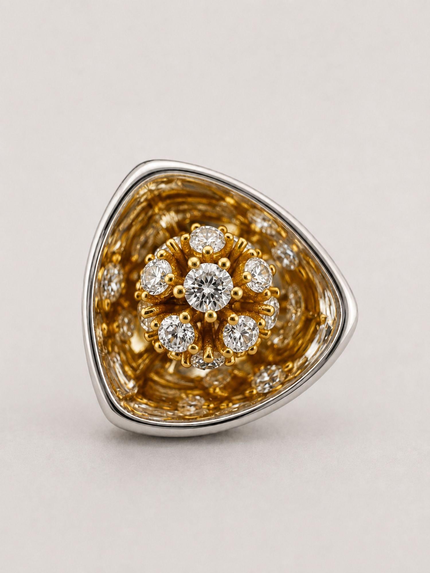 Angled close view of MHARI Irodori Small statement earring, gold zircon and 925 silver frame