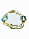 Abalone and gold link chain bracelet on white background, blue-green stones