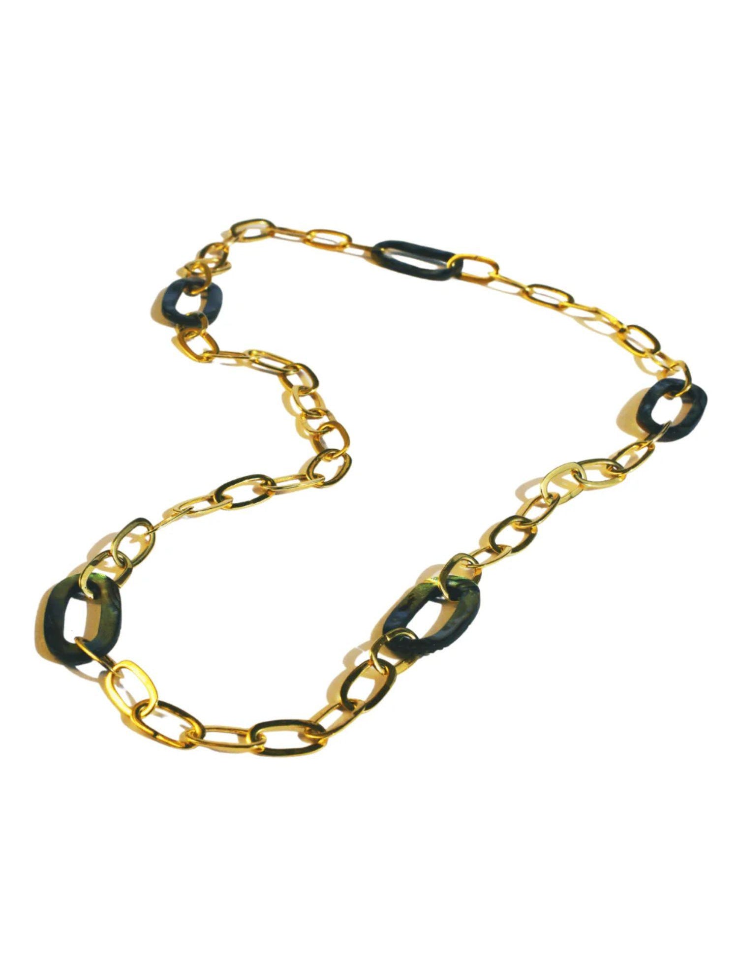 Gold oval link chain necklace with abalone stone links on white background