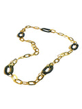 Gold oval link chain necklace with abalone stone links on white background
