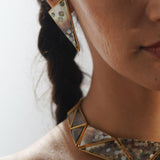 Mosaic earrings and necklace set worn together in warm profile editorial, full abalone detail visible.