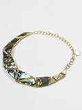 Mosaic statement necklace with handcrafted abalone and mother of pearl hexagon tiles in gold.