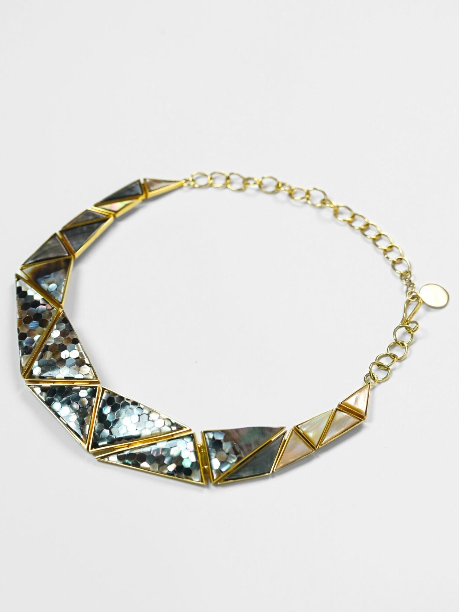Mosaic statement necklace with handcrafted abalone and mother of pearl hexagon tiles in gold.