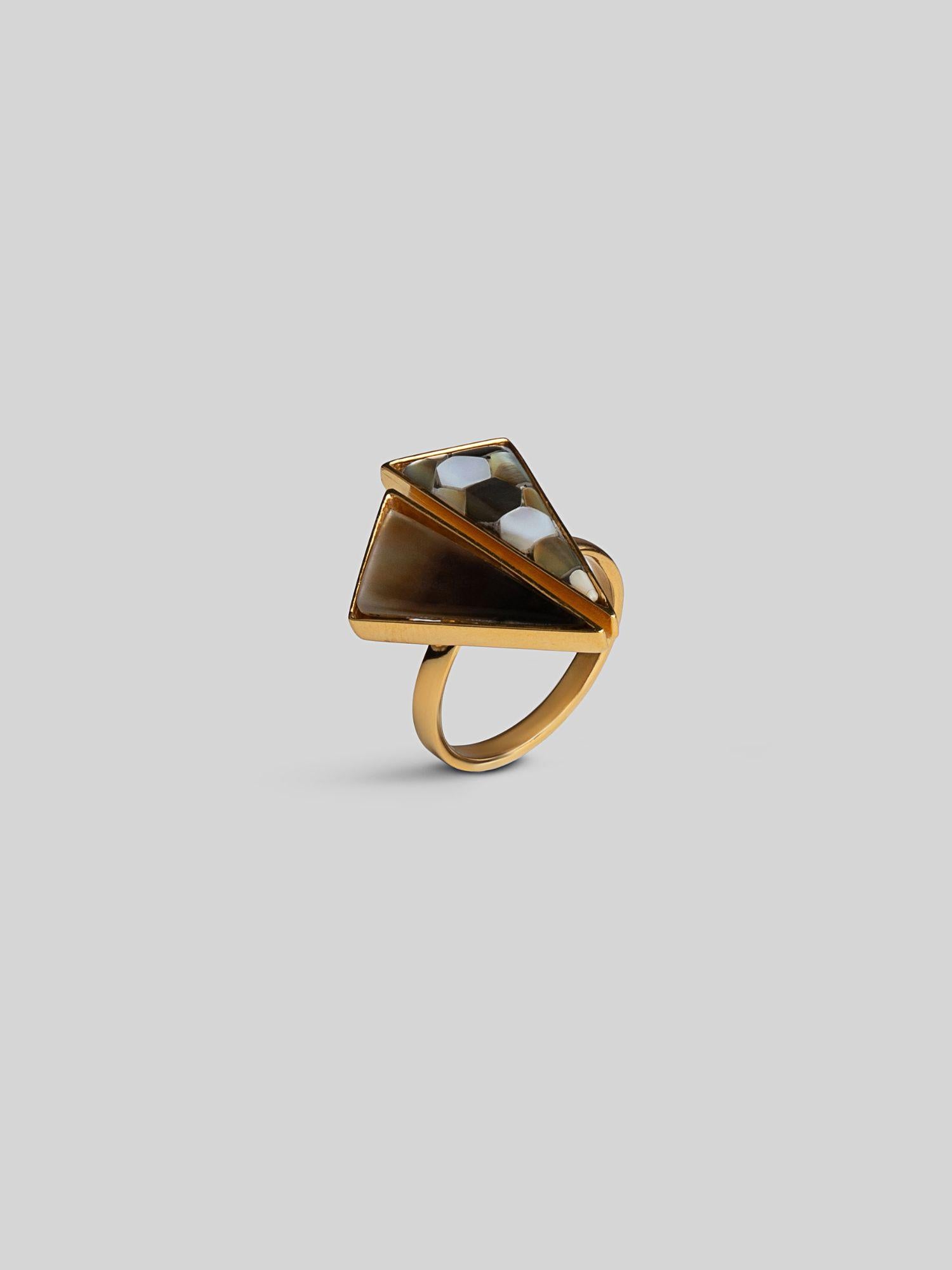 Sculptural Mosaic ring in 24k gold with abalone mother of pearl, angled on a clean surface.