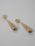Neris shell drop earrings with pearl stud and spiral shell form in 24k gold on neutral background.