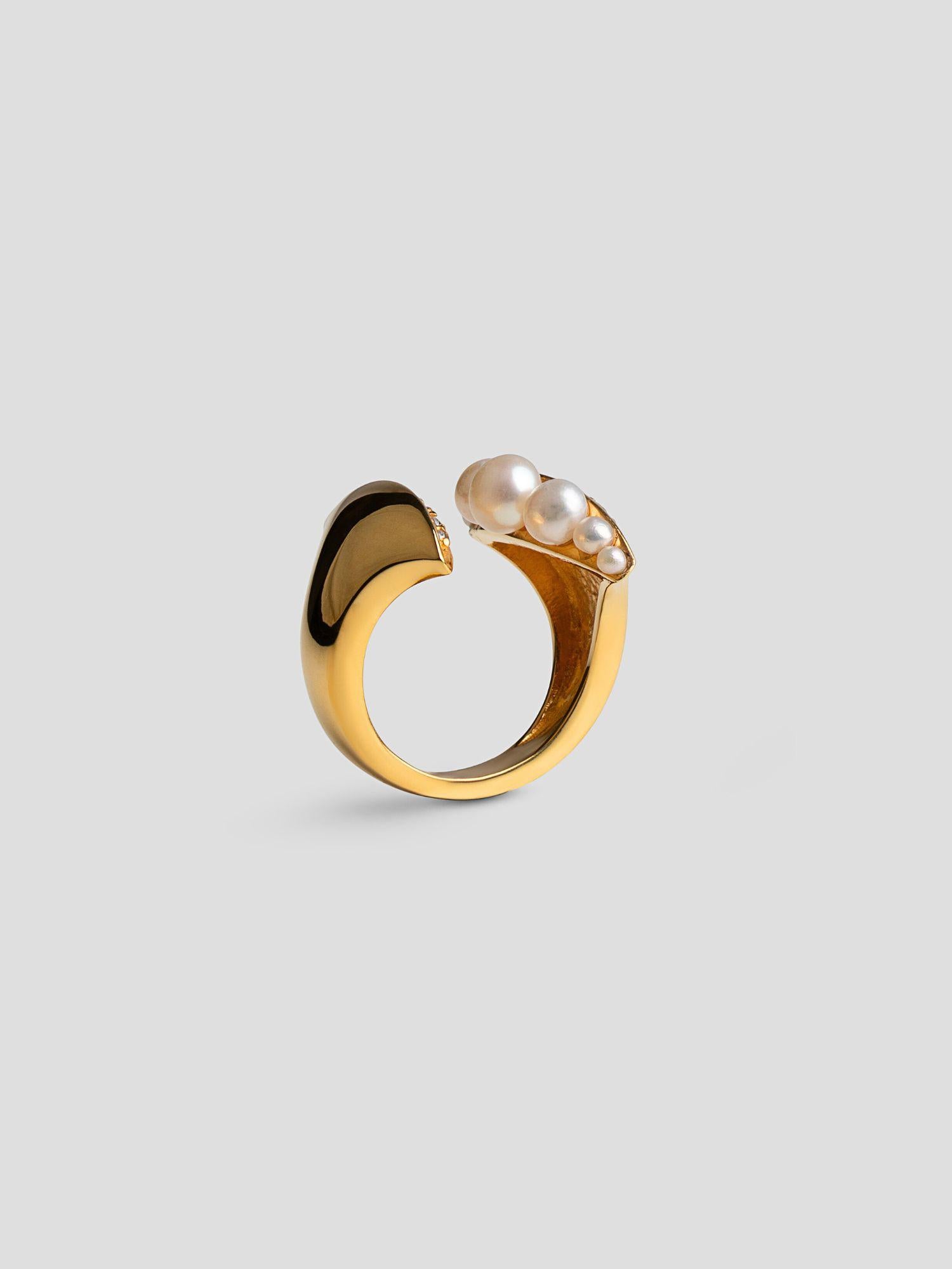 Top-down view of Noira cocktail ring with natural pearls set in open sculptural 24k gold band.
