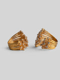 Two Nova rings side by side showing full sculptural star silhouette in gold on neutral background.