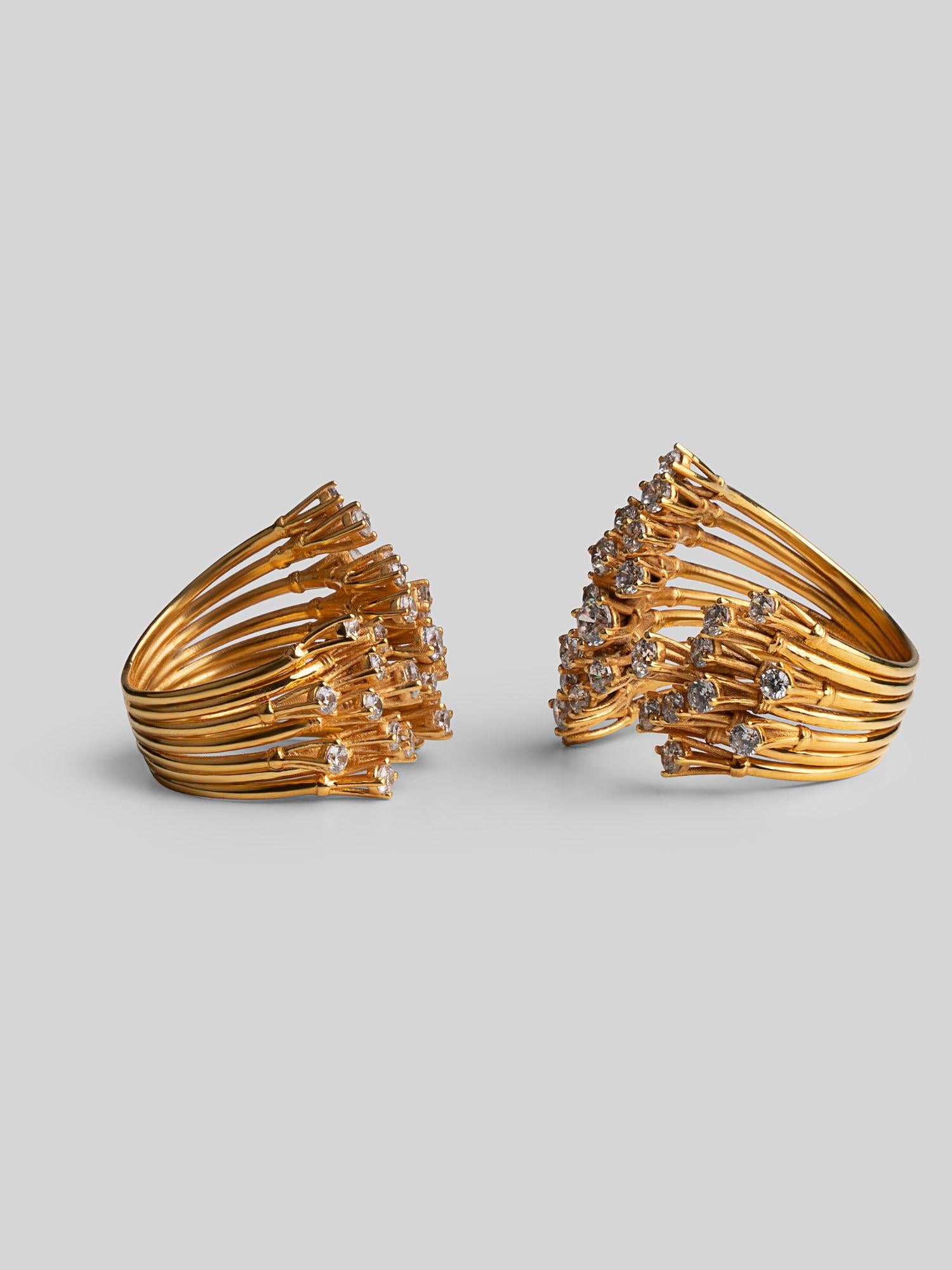 Two Nova rings side by side showing full sculptural star silhouette in gold on neutral background.