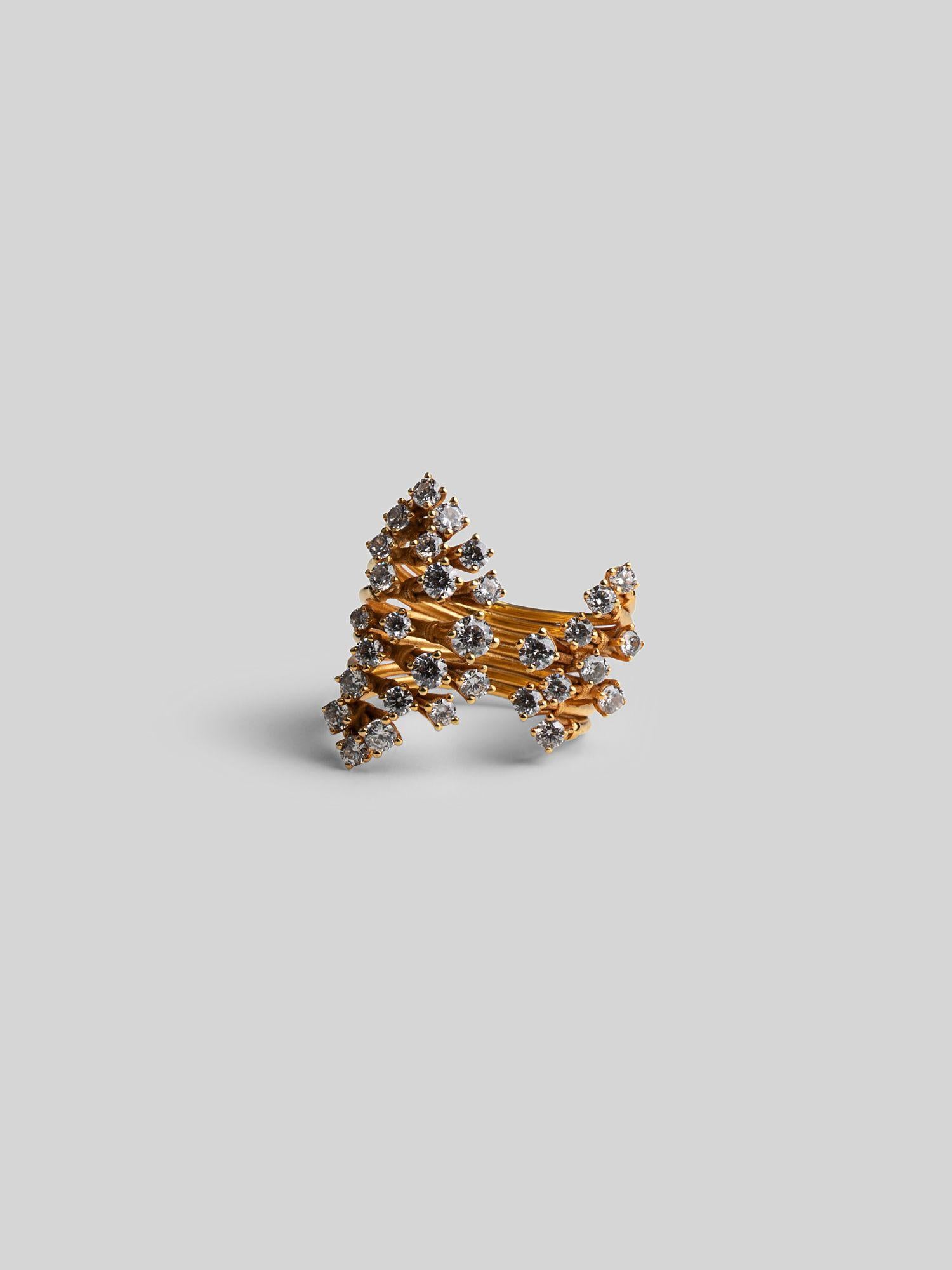 Side angle of Nova ring showing zircon-encrusted star form rising from a layered gold band.