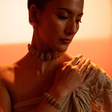 Model wearing Opal Perspective necklace and bracelet together in a golden-hour editorial portrait.