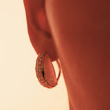 Close profile of Opal Perspective reversible statement earrings in 24k gold against warm skin.