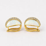 Angled side product shot of Opal Perspective reversible earrings showing depth and gold hinge clasp detail.
