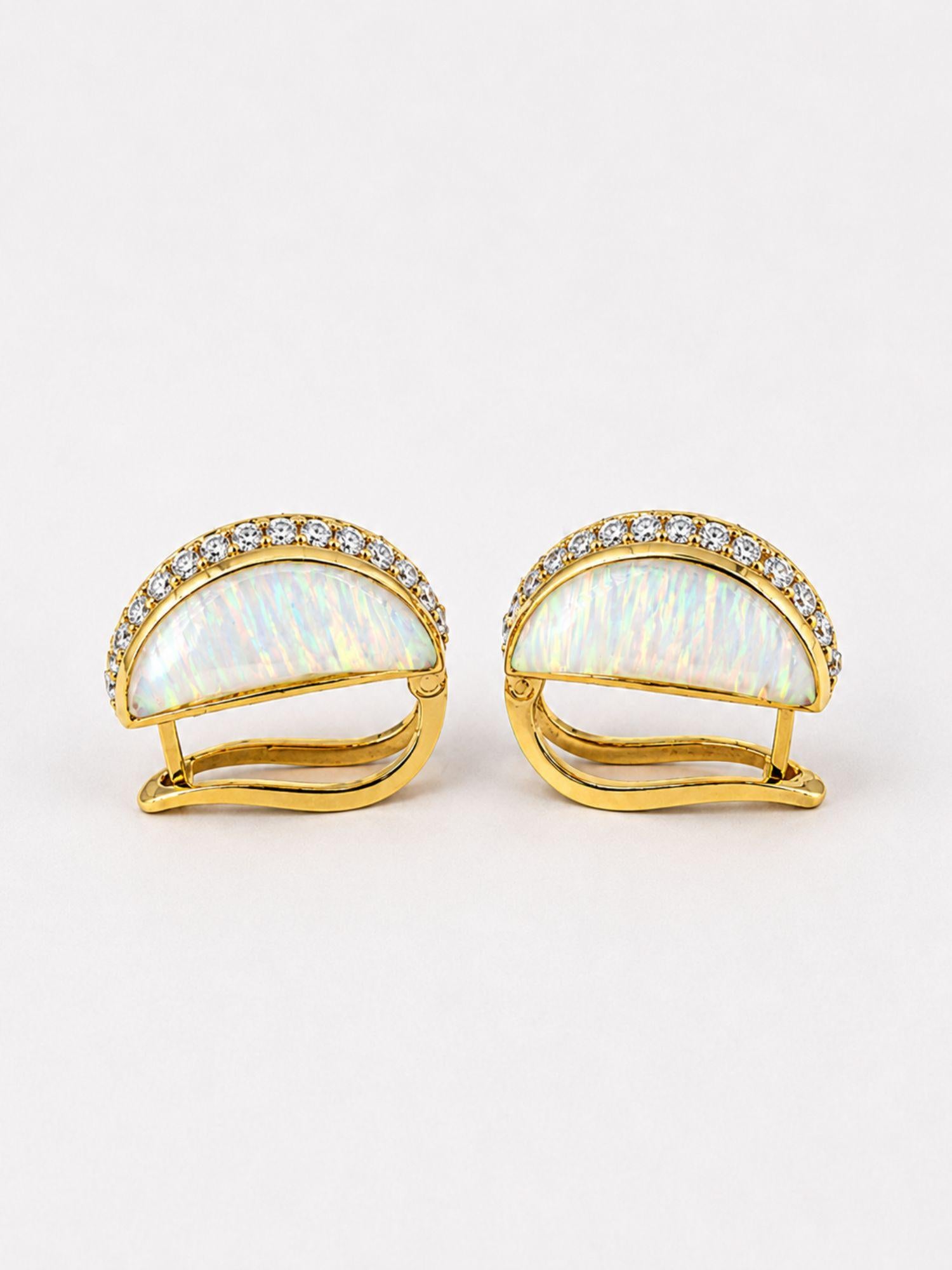 Angled side product shot of Opal Perspective reversible earrings showing depth and gold hinge clasp detail.