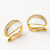 Angled product shot of Opal Perspective earrings showing gold clasp mechanism and opal face side by side.