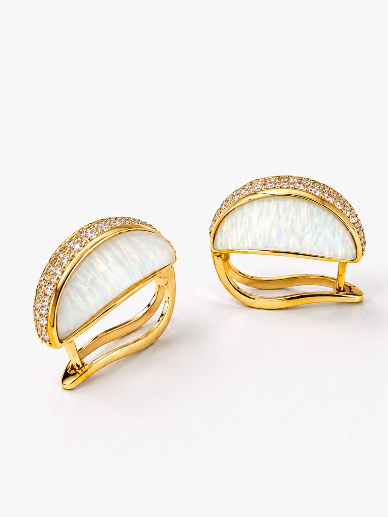 Angled product shot of Opal Perspective earrings showing gold clasp mechanism and opal face side by side.