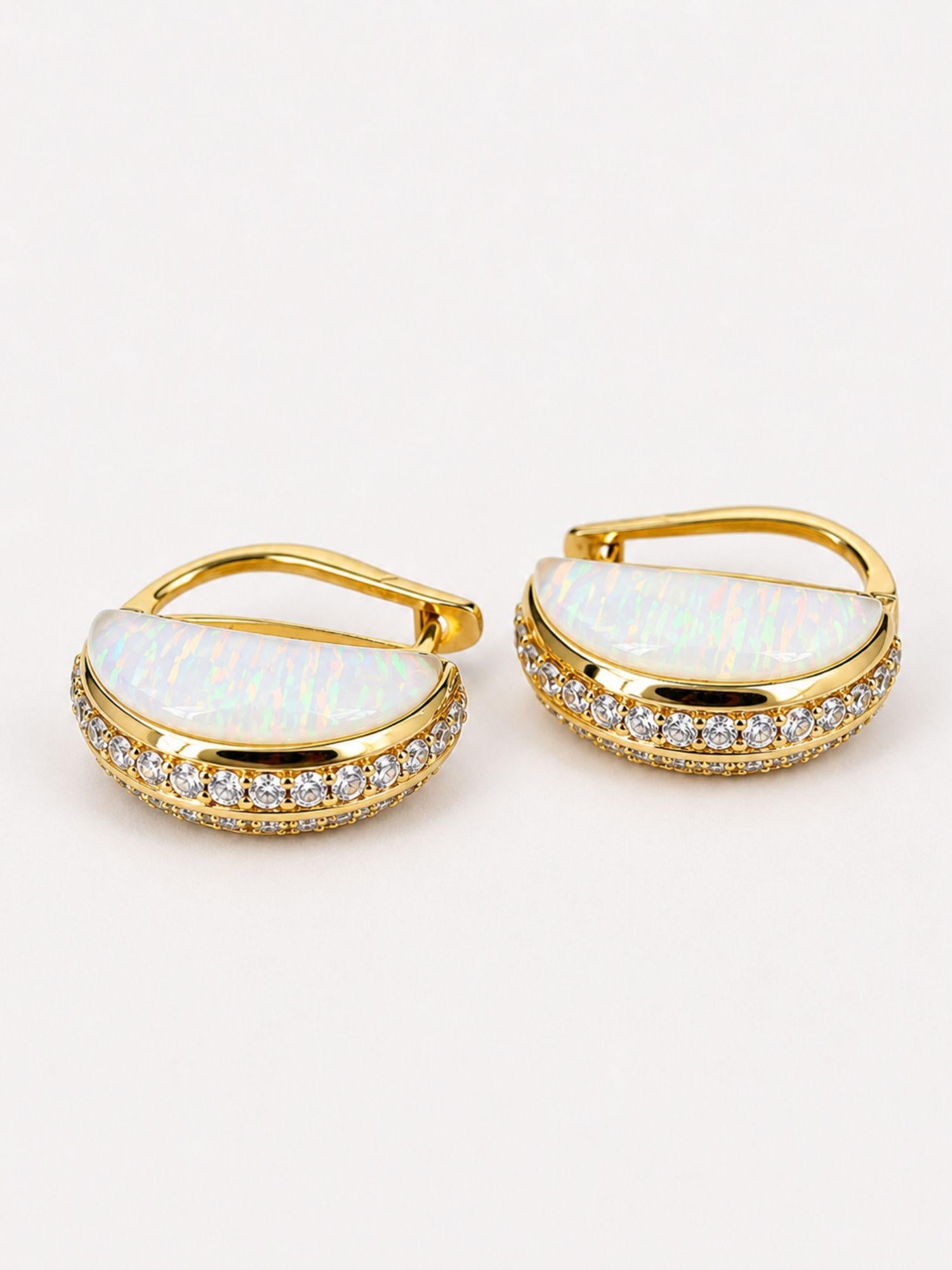 Close product shot of Opal Perspective earrings showing milky opal crystal haze face with zircon pavé edge.
