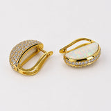 Reversible Opal Perspective earrings showing opal crystal haze face and zircon pavé border in 24k gold.