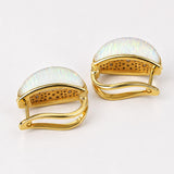  Three-quarter product shot of reversible Opal Perspective earrings in 24k gold on neutral background.