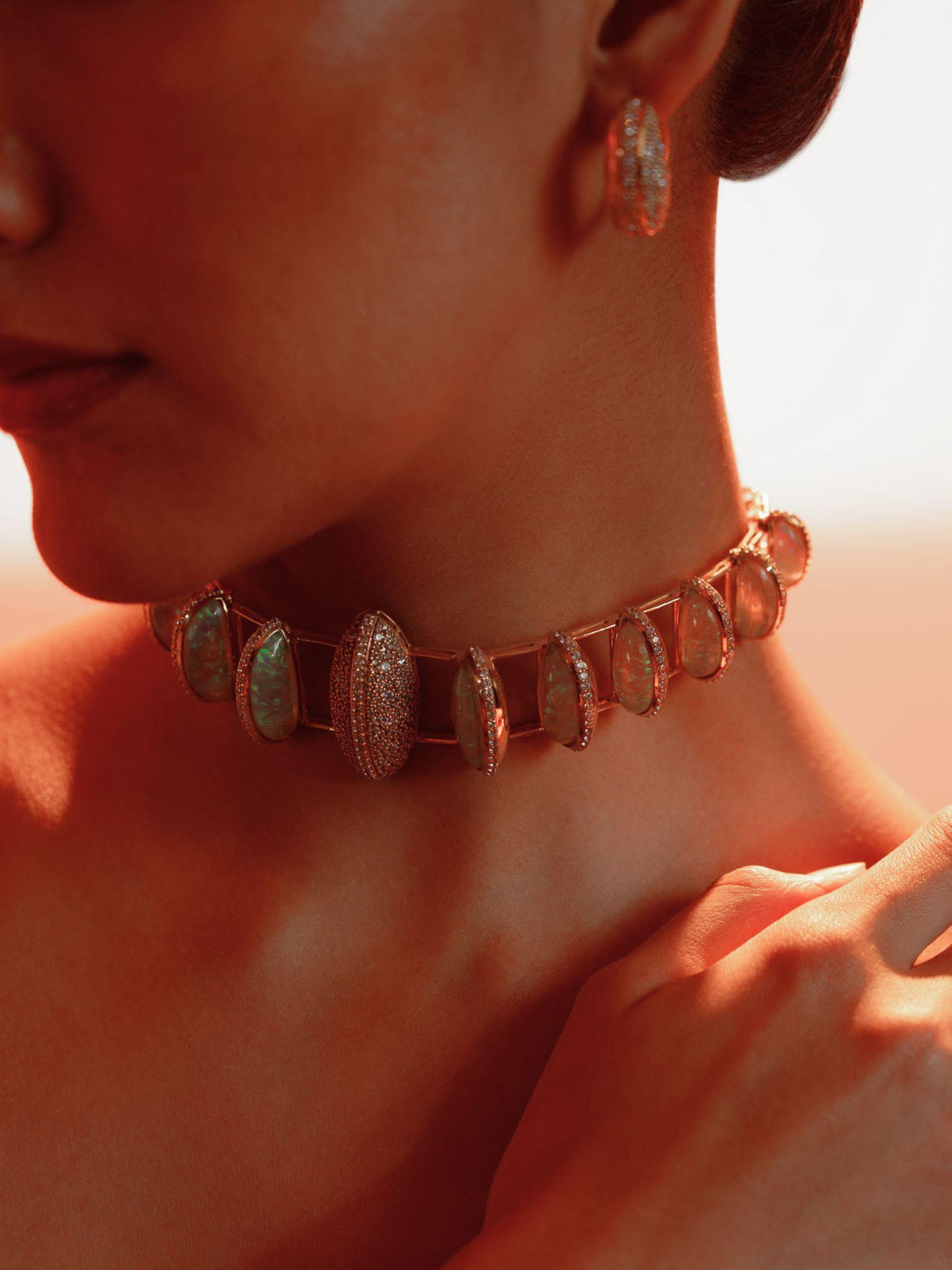 Opal Perspective necklace with opal crystal haze stones and green cord in 24k gold on neutral background.