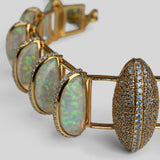 Close product shot of Opal Perspective necklace showing opal crystal haze and zircon detail in gold.