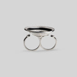 Top-down view of Orbis ring showing full black enamel spiral disc with zircon border in silver rhodium.