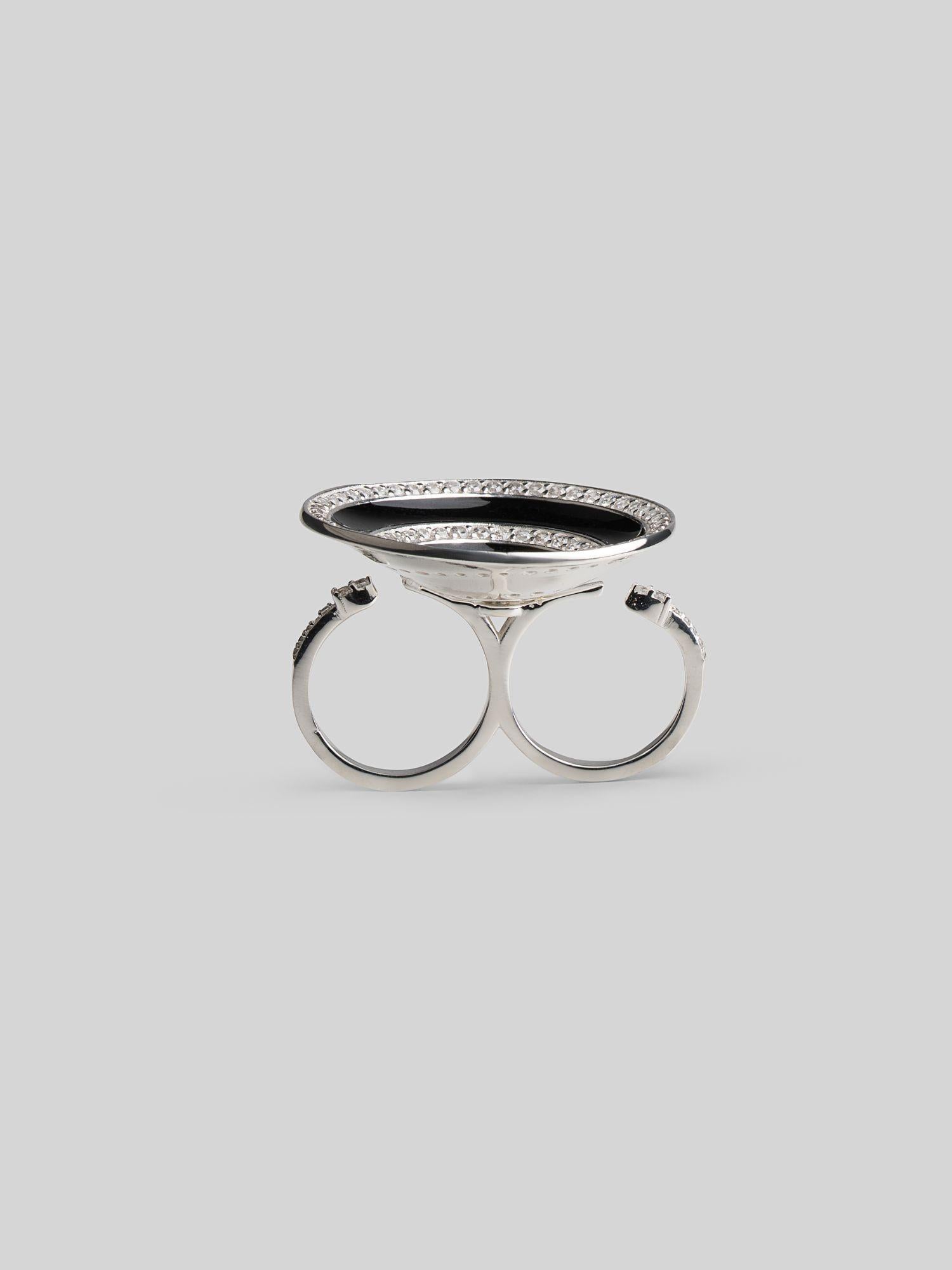 Top-down view of Orbis ring showing full black enamel spiral disc with zircon border in silver rhodium.