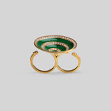 Orbis cocktail ring with spiral green enamel and zircon detail in 24k gold, front angle on neutral background.