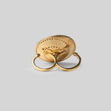 Orbis sculptural cocktail ring in plain 24k gold with zircon border, face-on on neutral background.