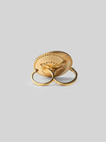 Orbis sculptural cocktail ring in plain 24k gold with zircon border, face-on on neutral background.