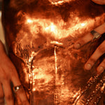 Handcrafted copper corset showing closeup and curved form