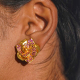 Pink CZ Rosara geometric rose statement earring worn on model in a close profile shot.