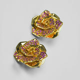 Rosara rose stud earrings with pink cubic zirconia petals in 24k gold on neutral background.