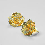 Rosara geometric rose stud earrings with white cubic zirconia in 24k gold on neutral background.