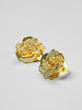 Rosara geometric rose stud earrings with white cubic zirconia in 24k gold on neutral background.