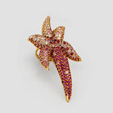 Angled side view of Starfish CZ ombré cocktail ring showing sculptural form and gold setting detail.