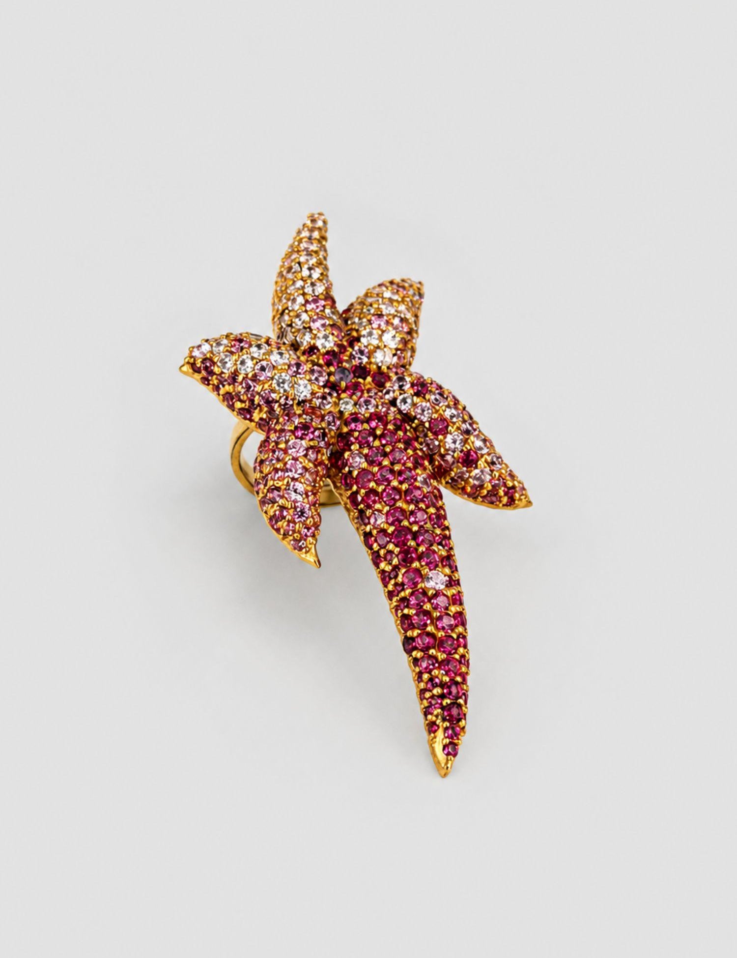 Angled side view of Starfish CZ ombré cocktail ring showing sculptural form and gold setting detail.