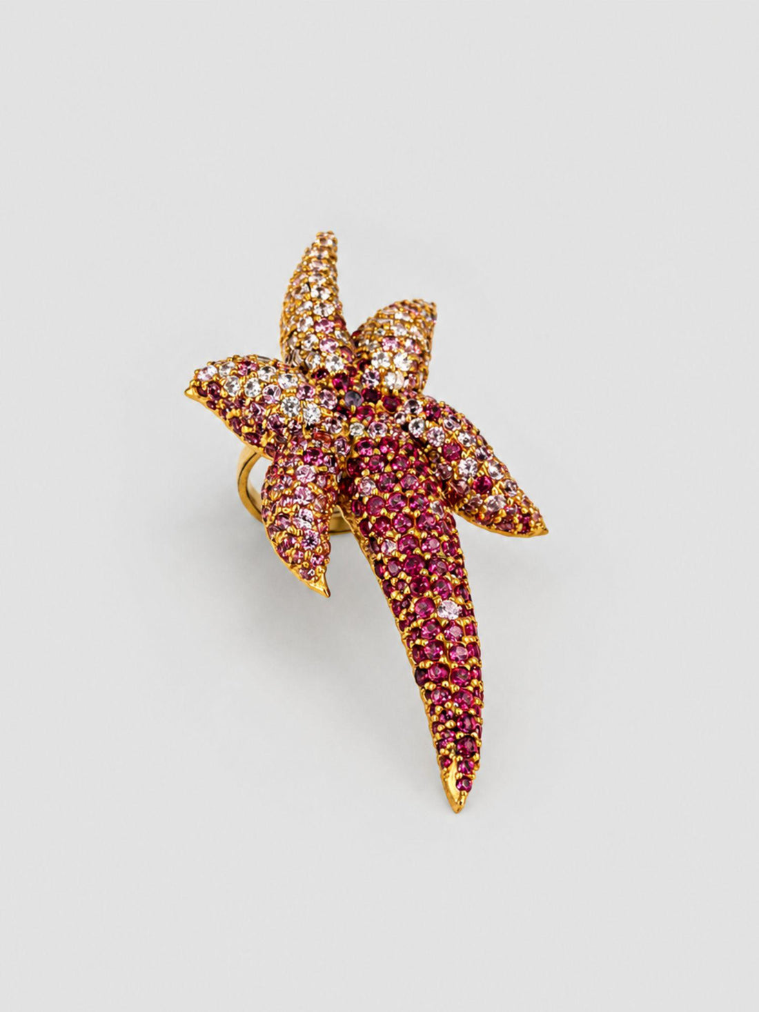 Starfish cocktail ring with hand-set AAA pink CZ ombré gradient in 24k gold, large front product shot.