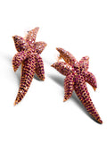 Overhead view of two starfish pendants with hand-set CZ ombre stones