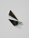 Tsugumi kintsugi triangular drop earrings with black enamel and gold crack detail on neutral background.