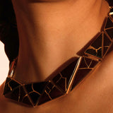 Tsugumi kintsugi collar necklace worn on model's neck in a clean portrait with neutral background.