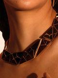 Tsugumi kintsugi collar necklace worn on model's neck in a clean portrait with neutral background.